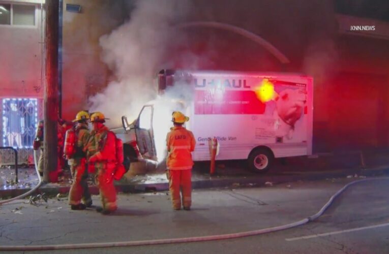 U-Haul goes up in flames after slamming into building in South L.A.
