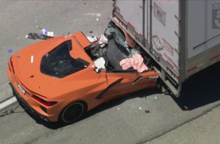 Driver hospitalized after sports car smashes into back of semi-truck