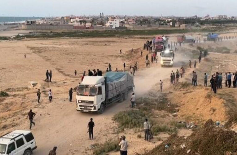 Trucks carrying desperately needed aid are rolling across a newly U.S. built pier into Gaza
