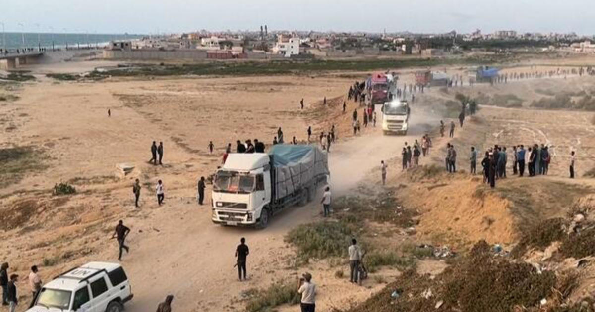 trucks-carrying-desperately-needed-aid-are-rolling-across-a-newly-us.-built-pier-into-gaza