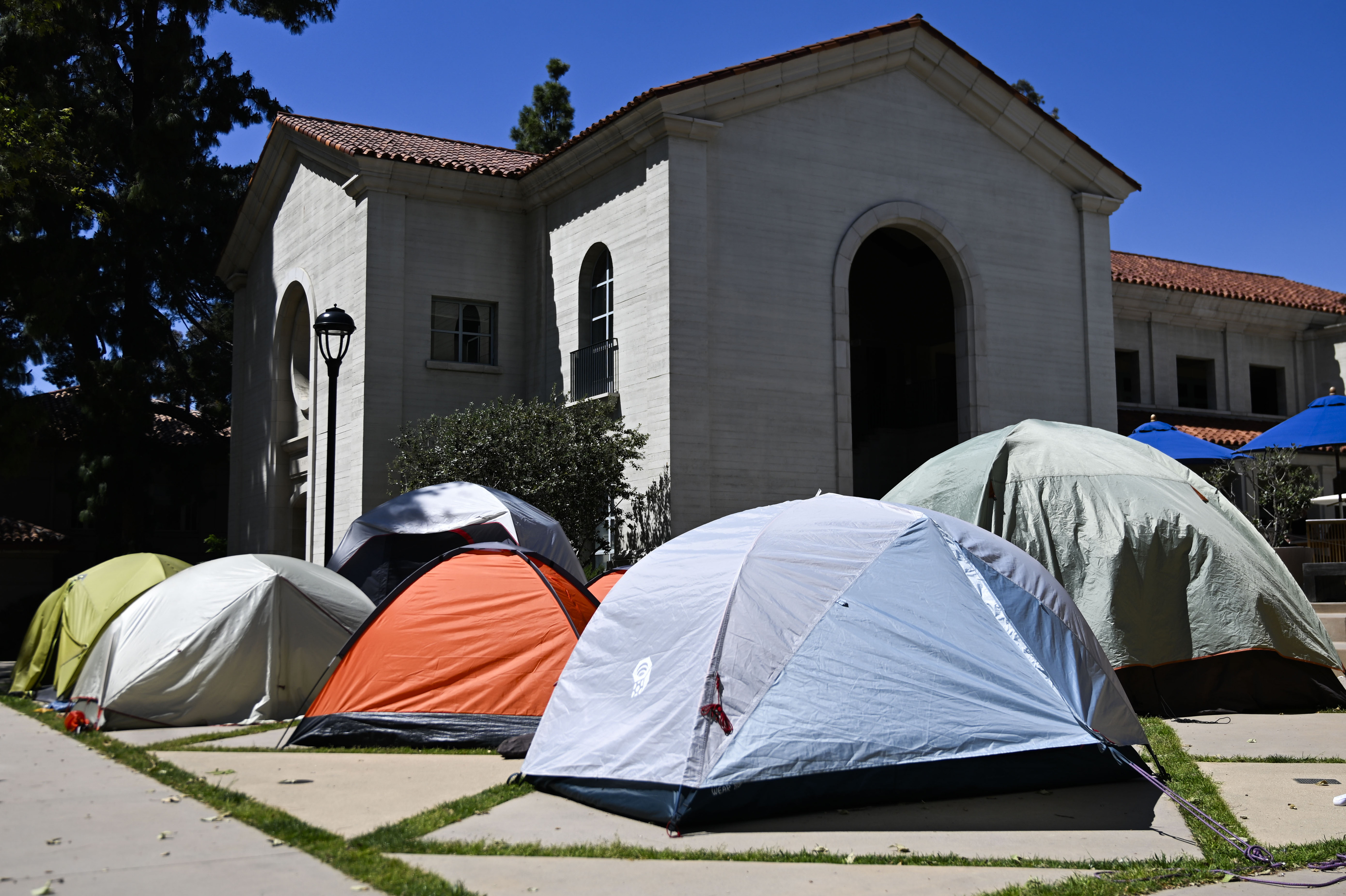 Tents of student protesters at Pomona College are set up...