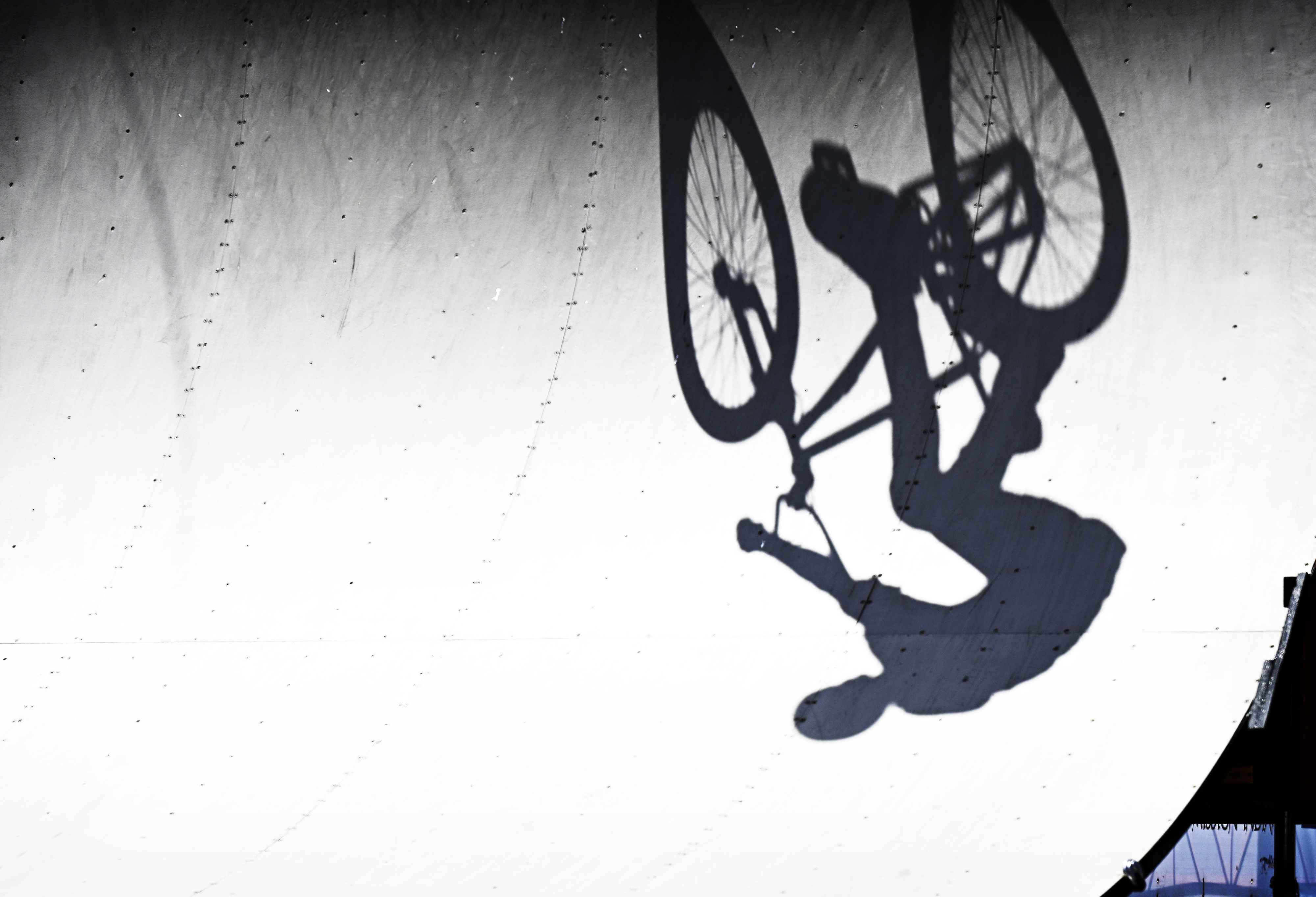 The shadow of a BMX rider is captured during the...