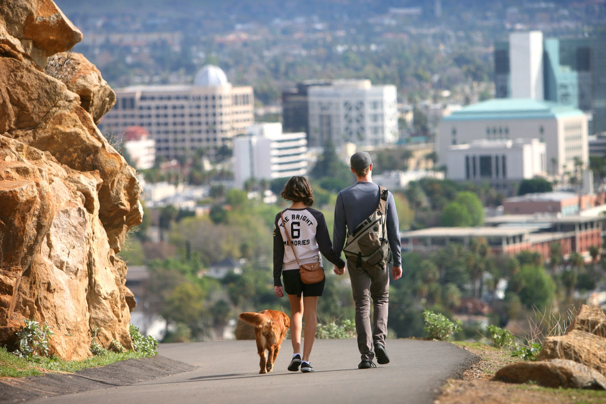 Jacquelyn Medina, at left, and Loren Ferard with Bailey the dog make their way down Mt. Rubidouix on Friday, January 29,2010. This last year there have been several improvements to Mount Rubidoux Park, including repaving the road up, a new front gate, new rock walls, and rock and iron benches. (Kurt Miller, The Press-Enterprise)