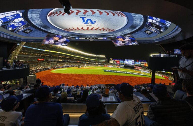 ‘It’s like you’re at the game.’ Fans enjoy cheering on Dodgers at immersive Cosm theater