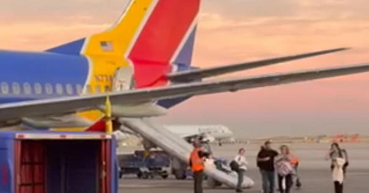 cellphone-battery-sparks-fire,-evacuations-on-southwest-flight-at-dia