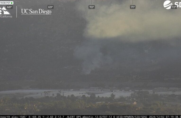 Smoke seen from I-15 in North County as fire burns mulch