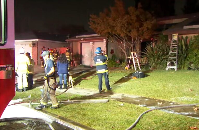 Neighbors pull woman to safety after house catches fire in northwest Fresno