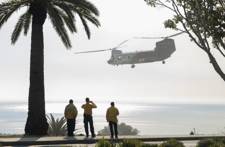 Raging Malibu fire burned to the Pacific Ocean but spared some hillside homes