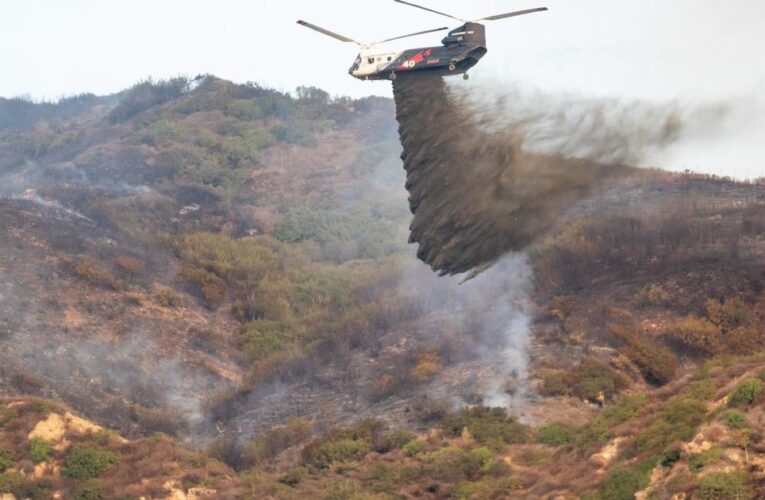 Firefighters battle Malibu wildfire as thousands evacuate