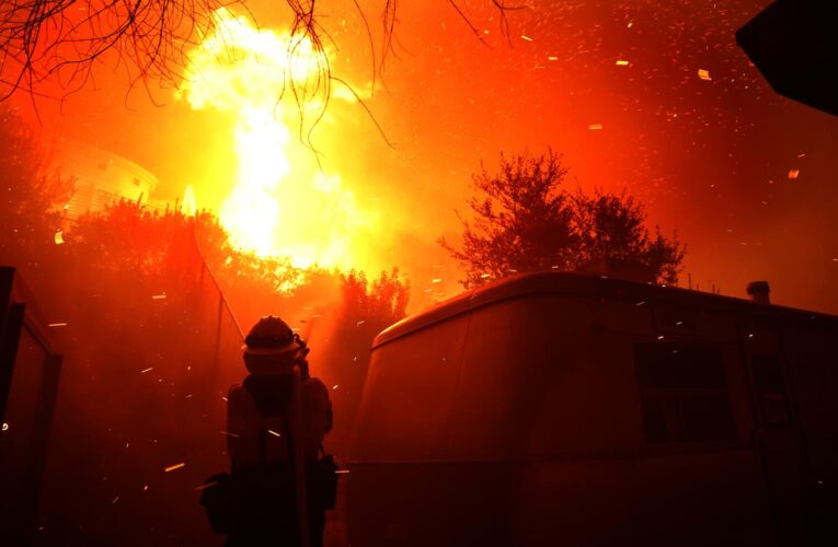 Firefighters continue to battle wind-driven fire in Malibu threatening homes