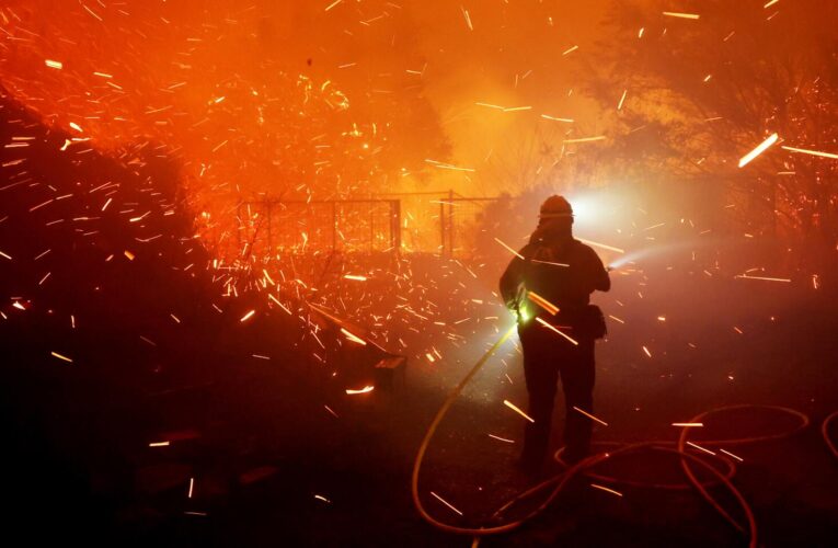 Wind-driven fire in Malibu continues to threaten homes as firefighters struggle to contain it