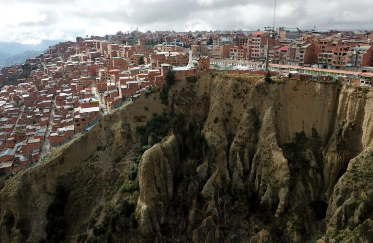 Shamans refuse to leave precarious cliff-top shacks in Bolivia