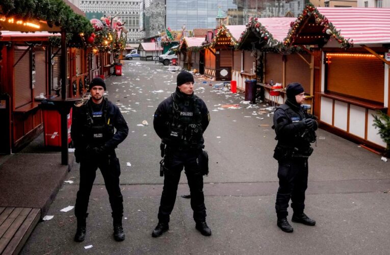 Germans mourn the 5 killed and 200 injured in the apparent attack on a Christmas market