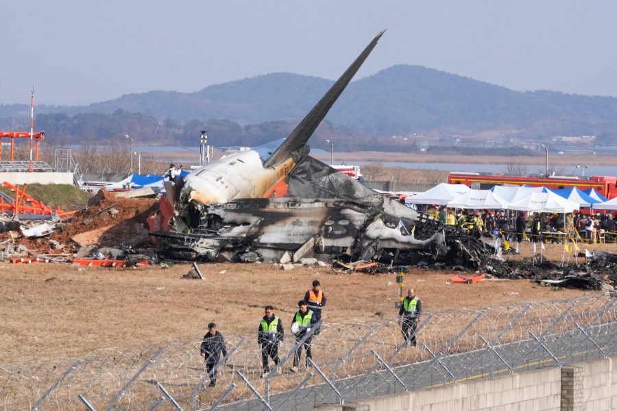 a-plane-is-engulfed-in-flames-after-skidding-off-the-runway-in-south-korea,-killing-at-least-177