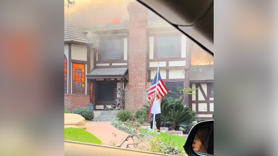 man-saves-flag-as-altadena-home-burns-during-eaton-fire:-video