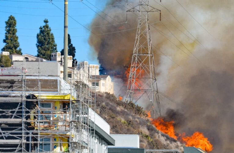 Forward spread of fire near Fashion Valley mall stopped, but evacuations remain in place