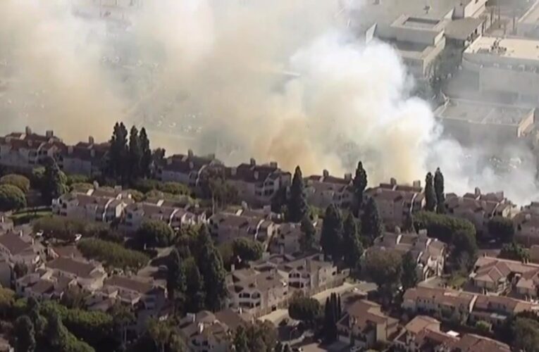 Brush fire threatening homes near Fashion Valley Mall knocked down